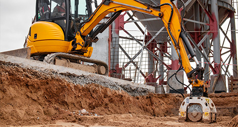 excavator on construction site digging earth heavy machinery operation soil work