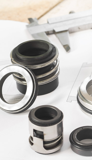 various mechanical seals arranged on a technical drawing with caliper tools close by for precise measurements in engineering applications